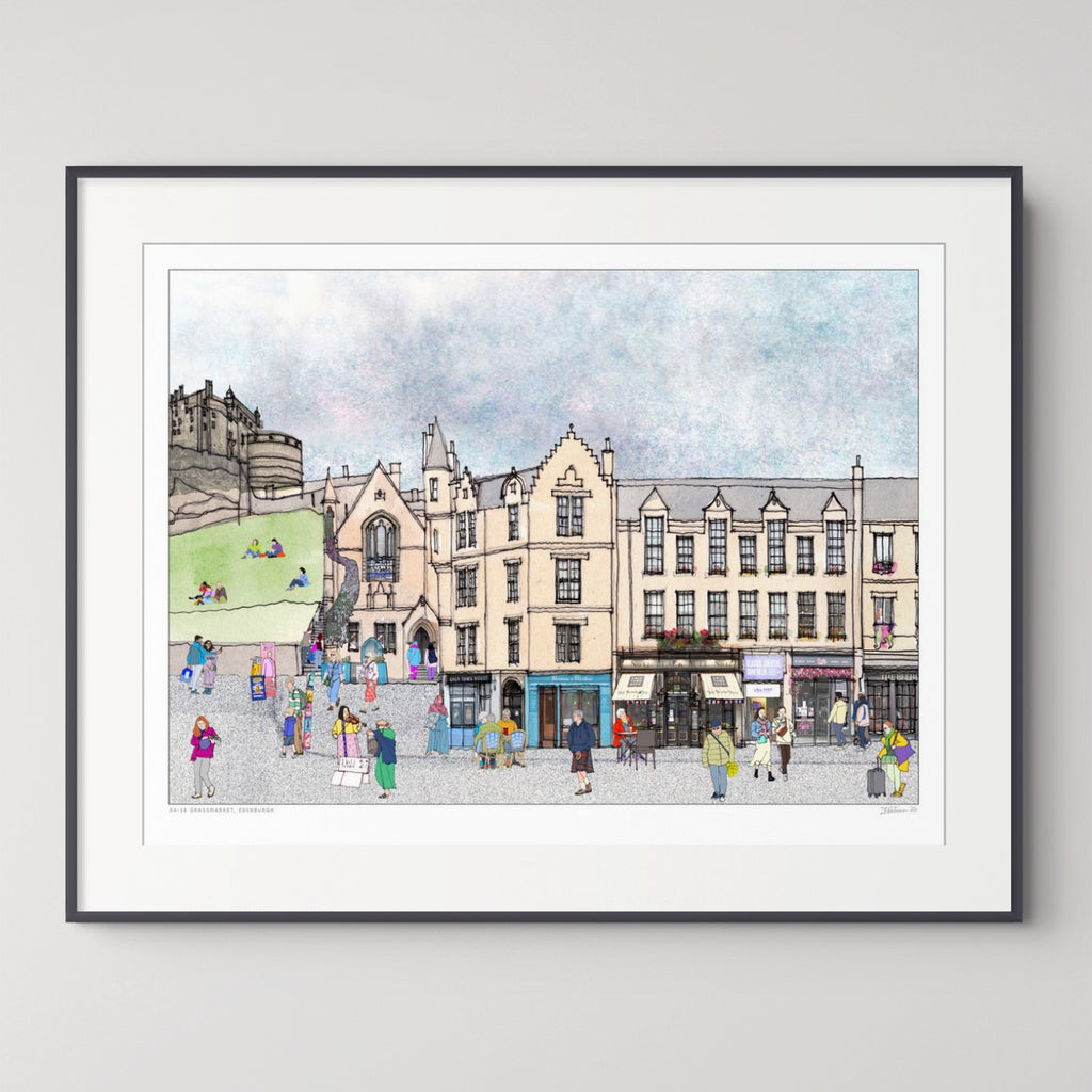 A framed art print depicting a colourful watercolour-style illustration of the Grassmarket in Edinburgh with historic buildings, a castle on a hill, and small figures of people walking and sitting. The print is presented with a wide white mat and a thin black frame against a light grey wall.