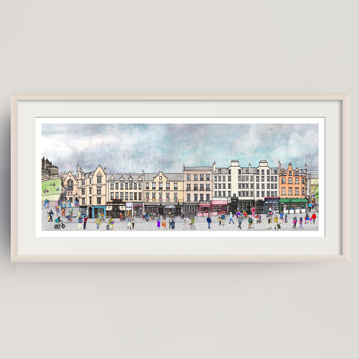 A framed panoramic watercolour print of Edinburgh's bustling Grassmarket, with historic buildings, pedestrians, and a cloudy sky, displayed against a light grey wall.