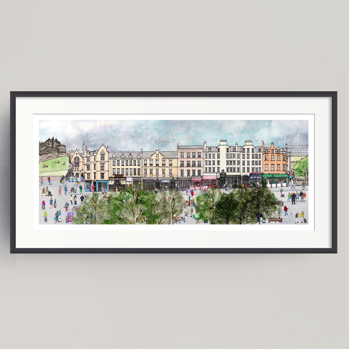 A framed panoramic watercolour print of the bustling city square of Edinburgh's Grassmarket, featuring historic buildings, pedestrians, and green trees, presented on a neutral light grey background.