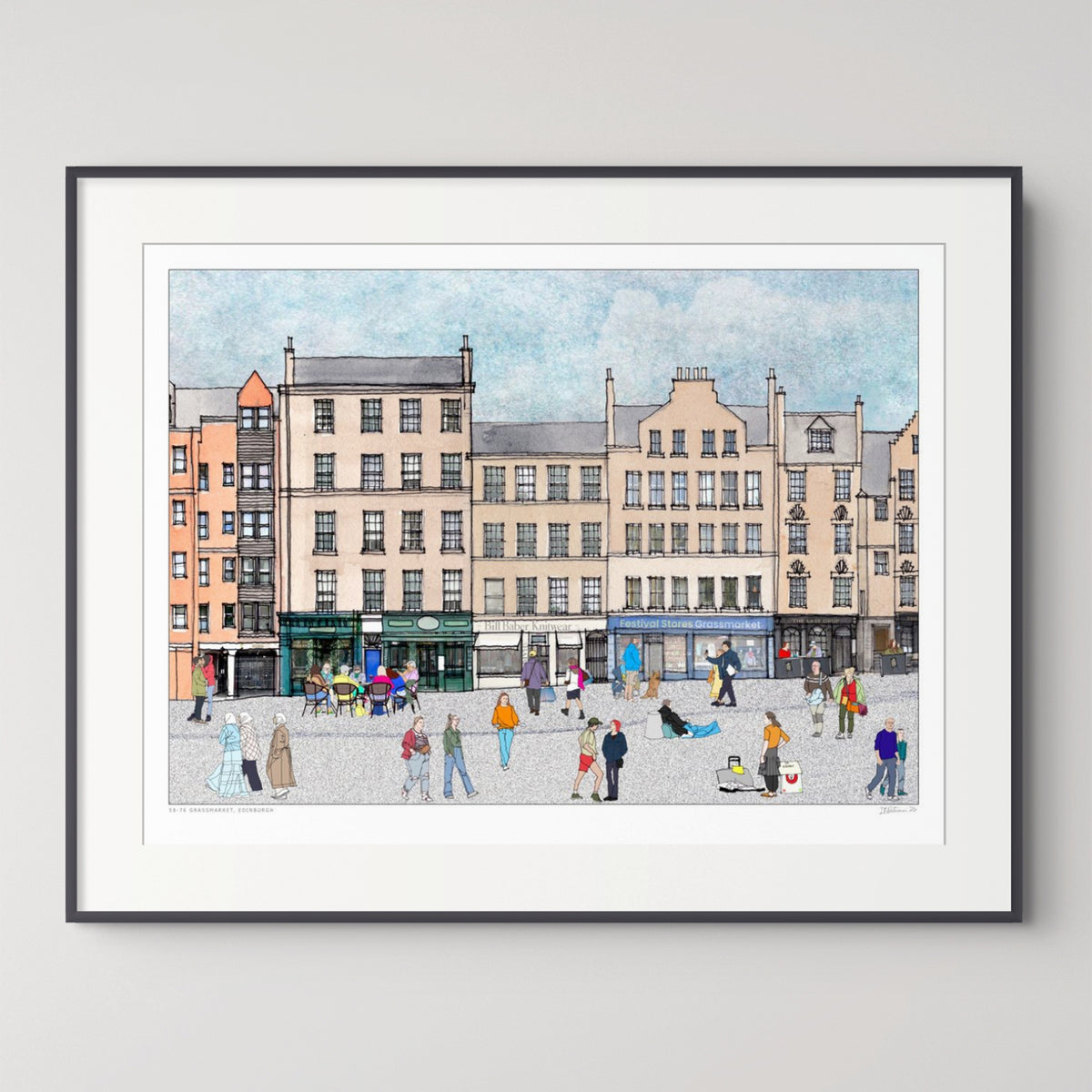 A framed art print depicting Edinburgh Grassmarket with classic buildings, shops, and people, presented in a white mat and a thin black frame against a light grey wall.