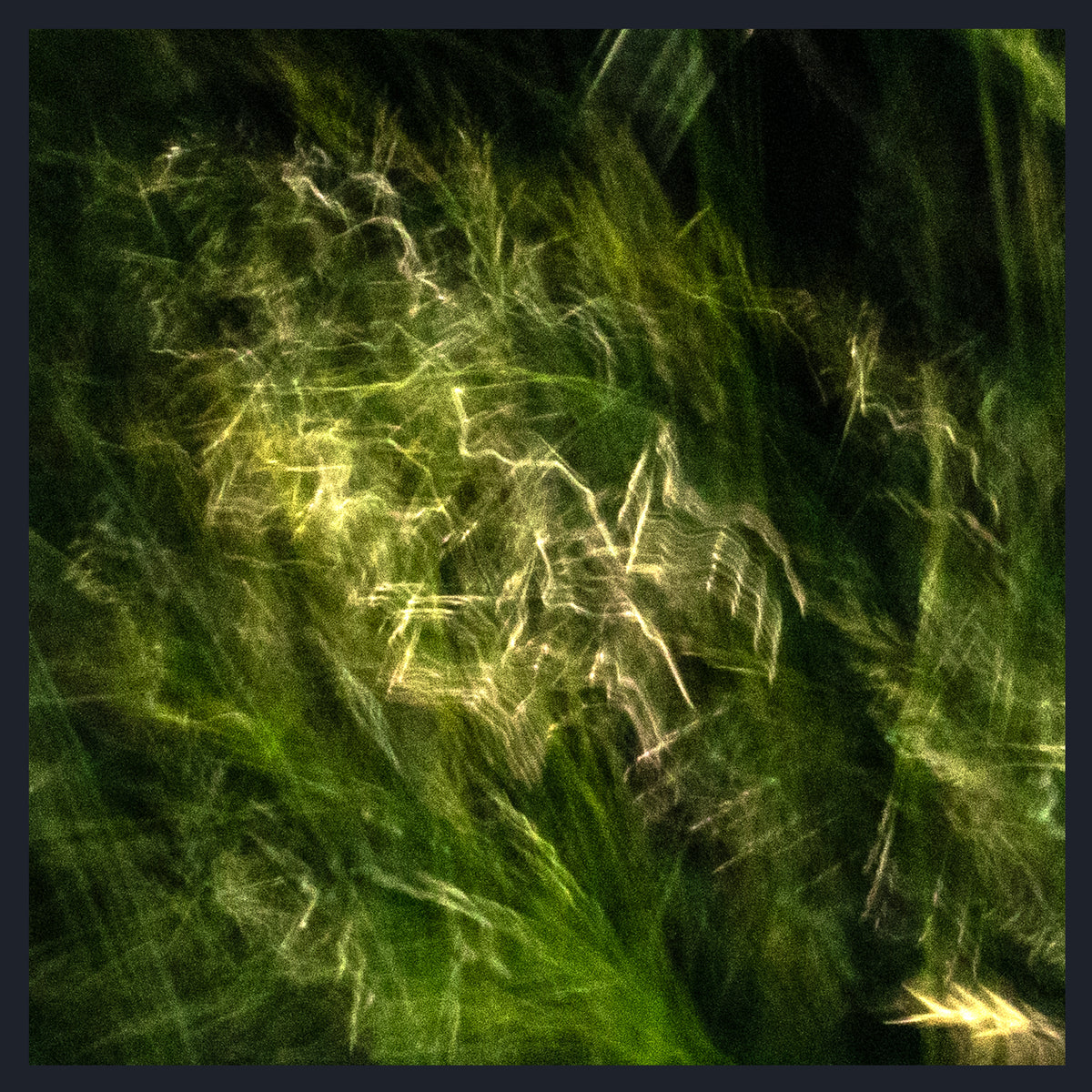 Abstract textured artwork depicting swirling green and yellow light streaks over a dark background, framed by a dark border.